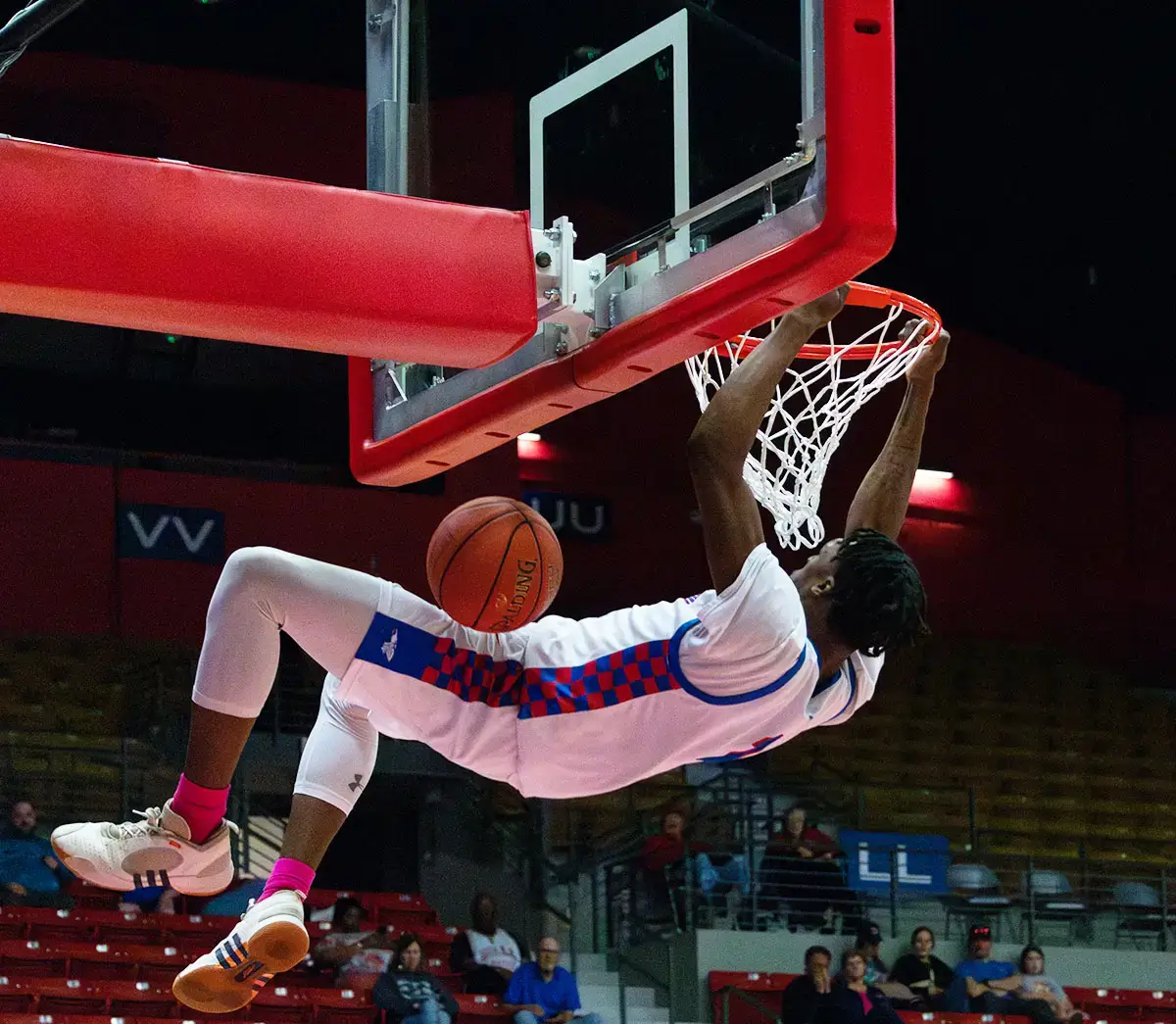 Short basketball player at 5'9 achieving a slam dunk using vertical jump training